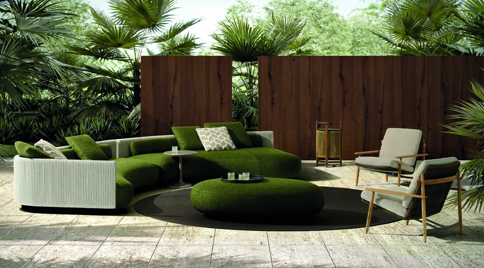 Minotti Bézier curved outdoor sofa with cord back on a terrace, Minotti outdoor furniture