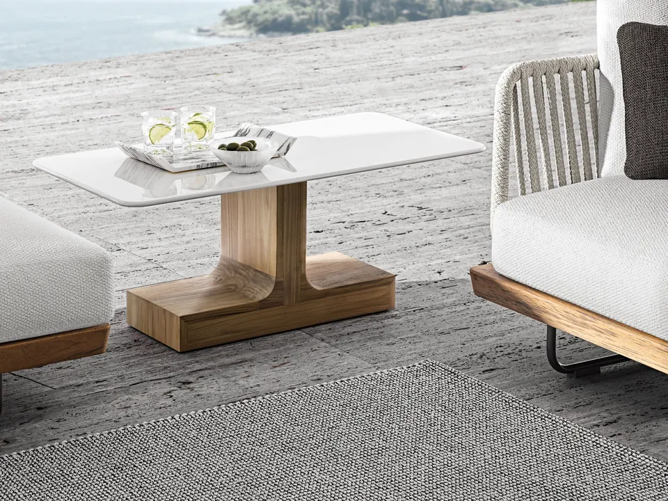Minotti Block teak outdoor coffee table with stone top on a terrace, Minotti outdoor furniture