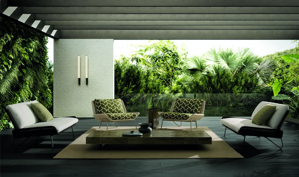 Minotti Emmi Cord outdoor sofa with a woven cord frame on a terrace, Minotti outdoor furniture
