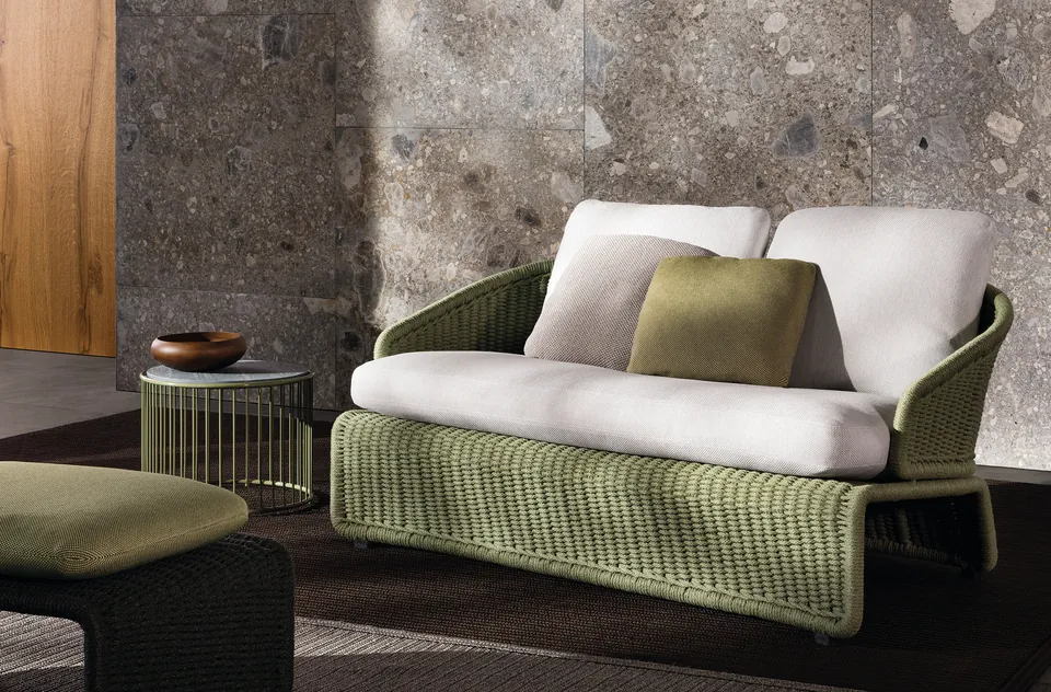 Minotti Halley outdoor armchair and daybed in woven cord by a pool, Minotti outdoor furniture