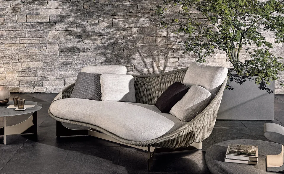 Minotti Lido Cord outdoor sofa and armchairs around a stone table, Minotti outdoor furniture