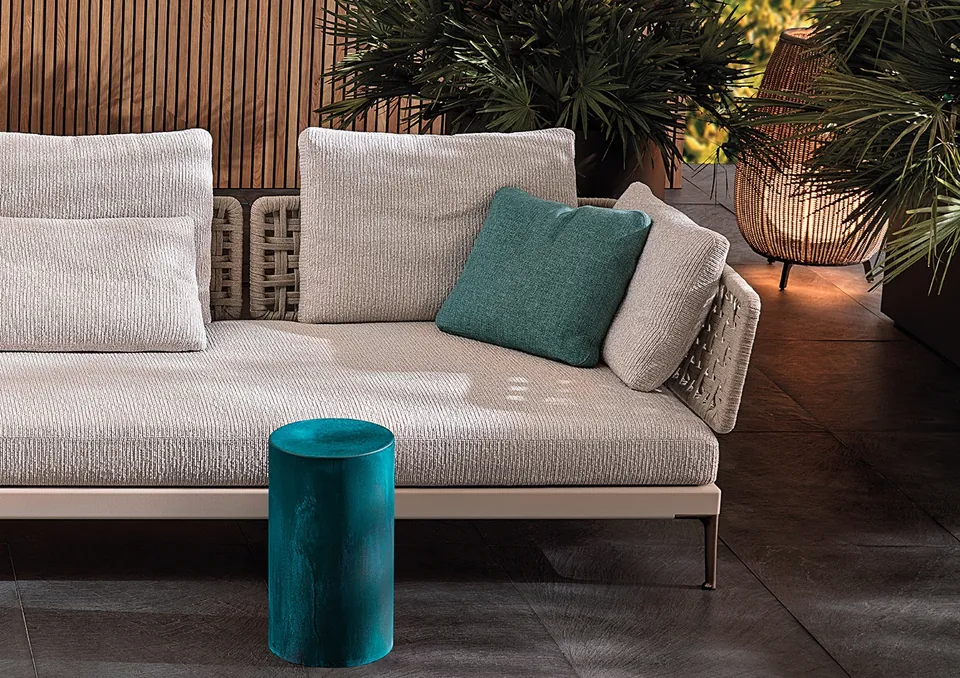 Minotti Pilotis round stainless steel coffee table on an outdoor terrace, Minotti outdoor furniture