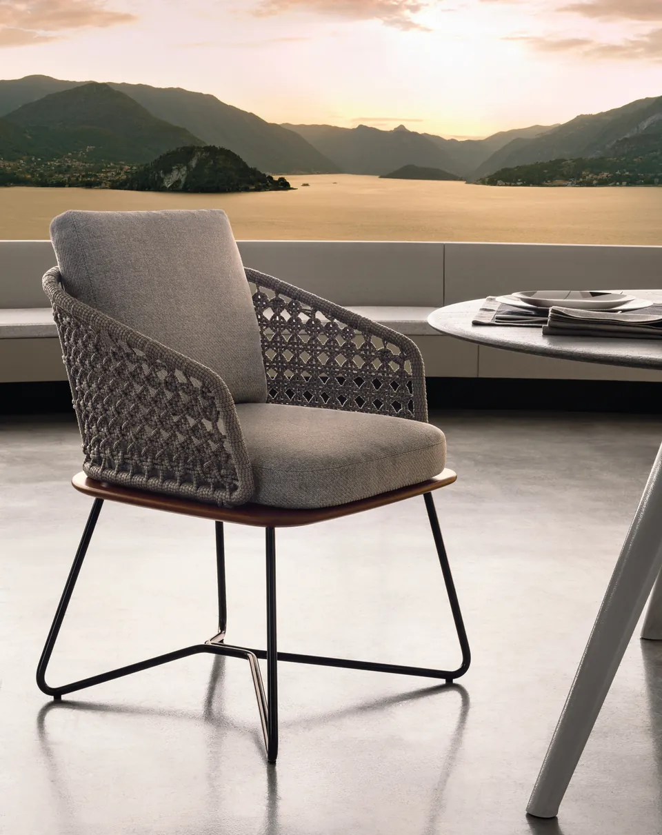 Minotti Rivera armchair in iroko with cannage weave back, catalog photograph