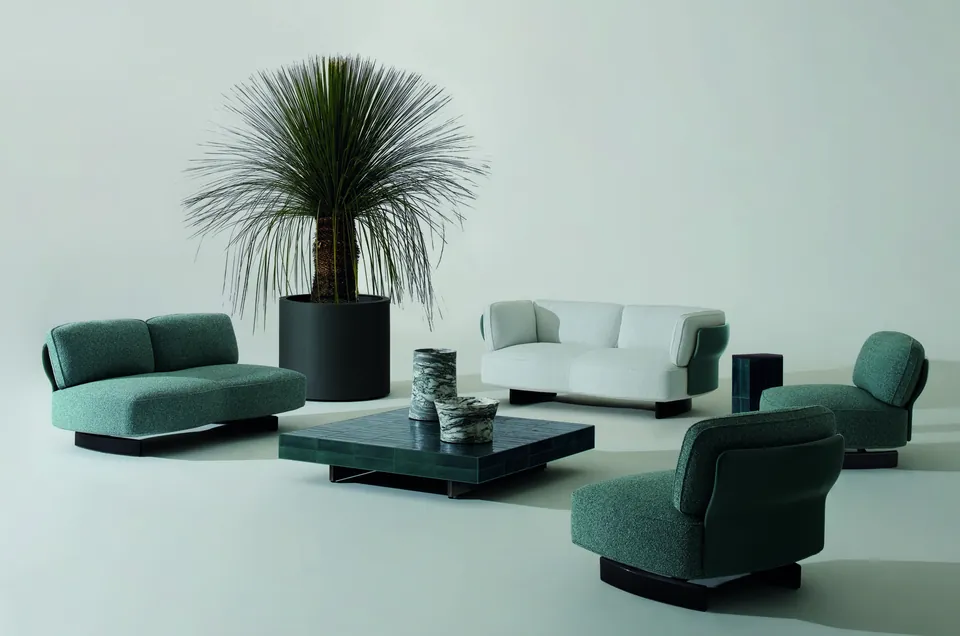Minotti Saki curved outdoor sofa with petal-shaped panels on a terrace, Minotti outdoor furniture
