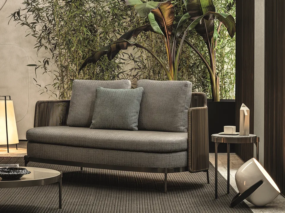 Minotti Tape Cord outdoor sofa with corded frame on a rooftop terrace, Minotti outdoor furniture